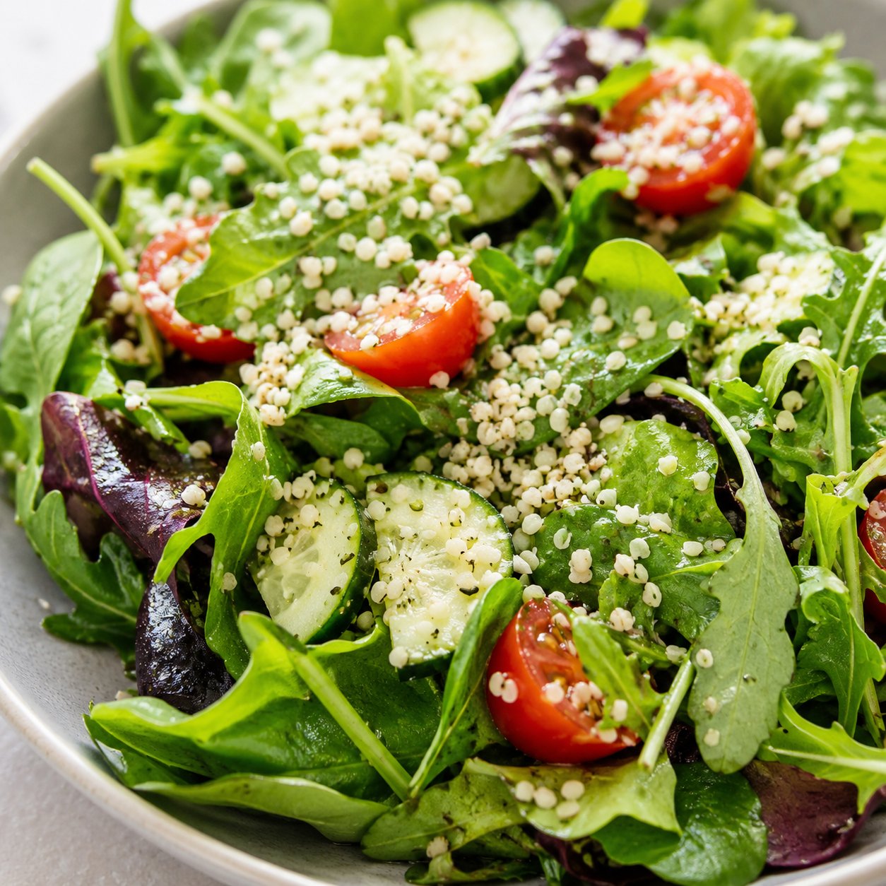Hemp seeds scattered over a green salad