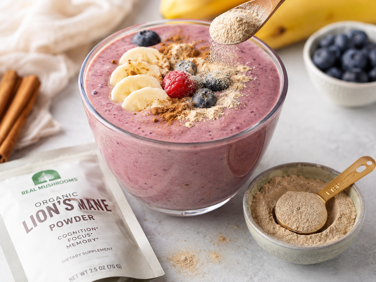 Berry banana smoothie with a spoonful of lion's mane powder